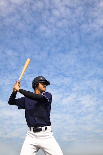 Baseball Player With Wood Bat